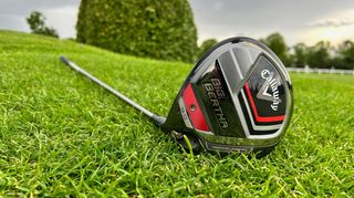 Callaway Big Bertha 2023 Driver resting on the golf course showing its red and black sole
