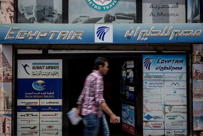 A travel agency in Cairo displays advertisements for EgyptAir.