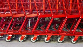 An IBM whitepaper cover with red shopping carts on supply chain management