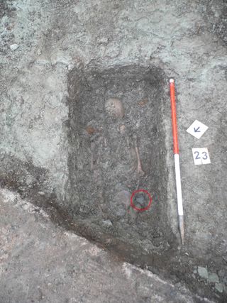 The grave of skeleton 23, likely a Late Roman soldier or civil servant. Researchers found the belt buckle next to the right hip (circled).