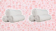 White rolled towels on pink soapy background