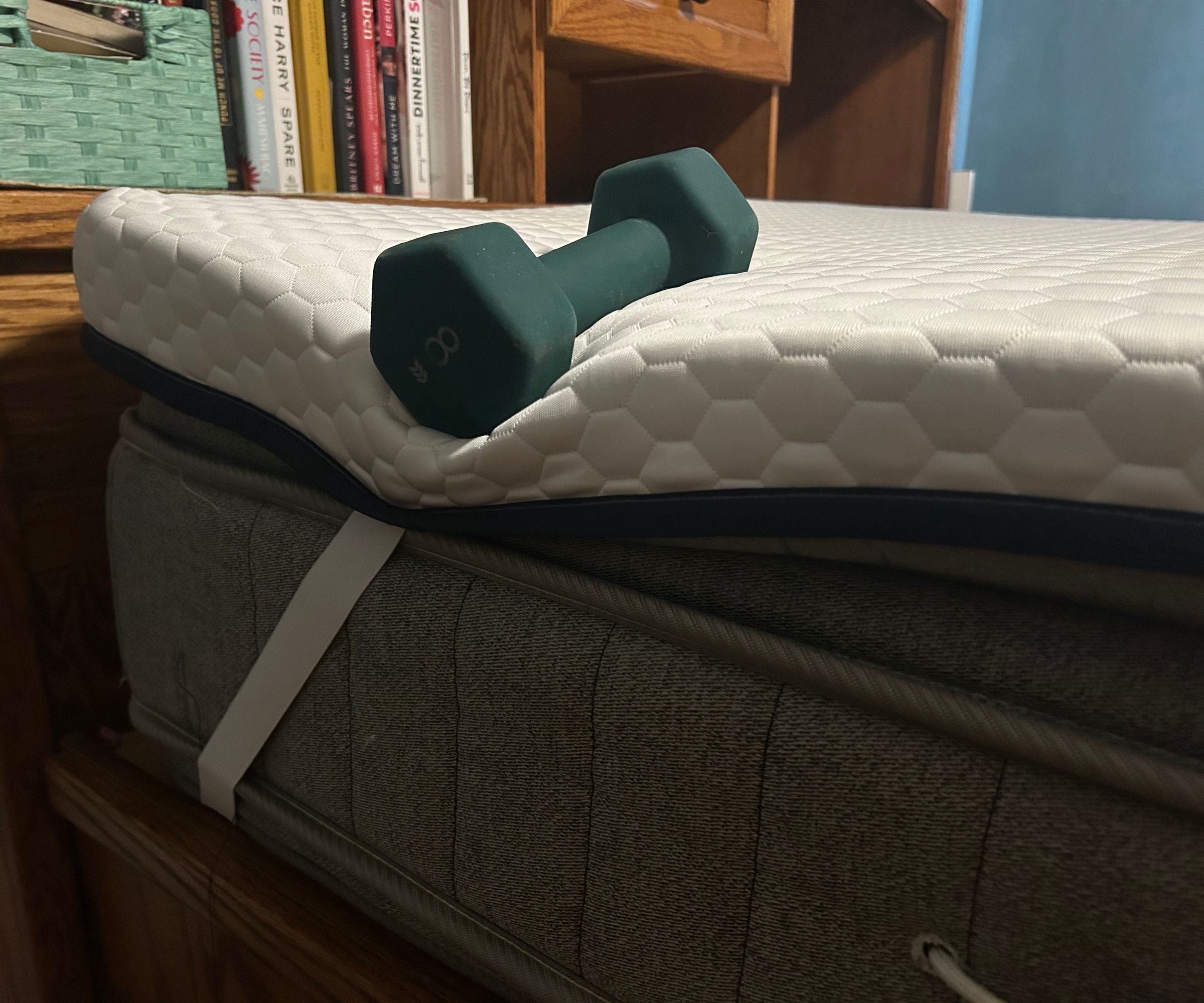 dumbell on a mattress topper