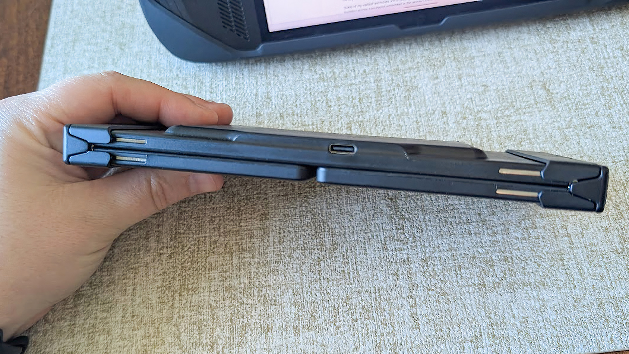 Artciety Foldable Bluetooth Keyboard folded up.