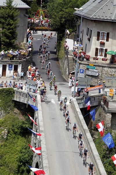 The peloton rolls through a pictureseque Alpine village en route to Saint-Jean-de-Maurienne.