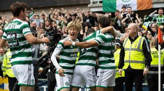 Celtic players celebrate one of the goals in their incredible 9-0 win at Dundee United.