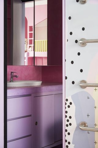A pink room leads into a similar color scheme in the ensuite