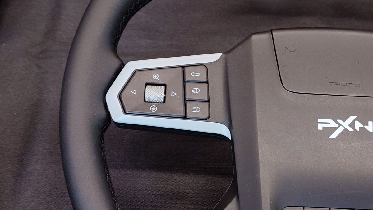 Close up photos of the new and unreleased PXN truck simulator wheel showing the design and controls.
