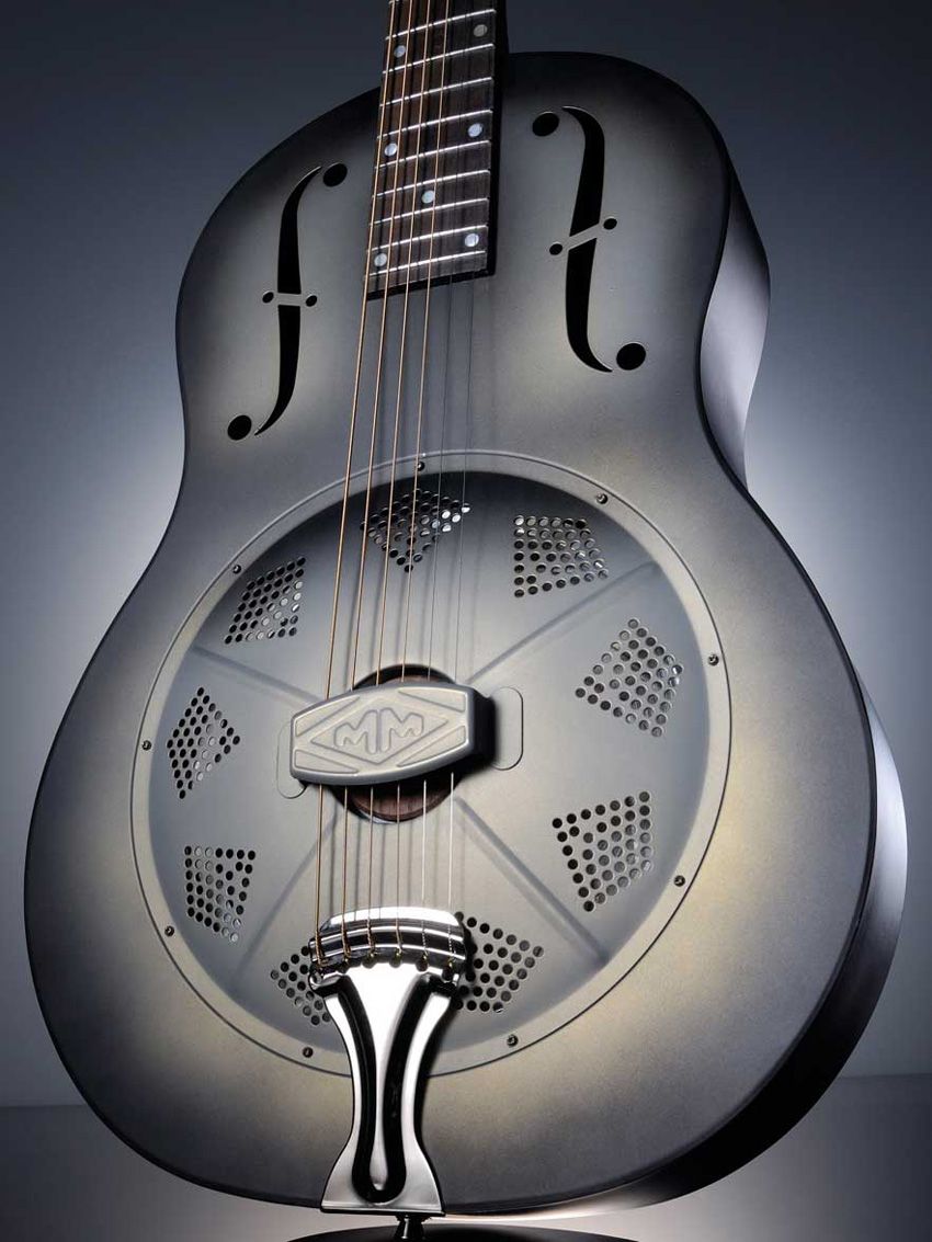 Under the 'colander' front of this guitar is the aluminium resonator cone