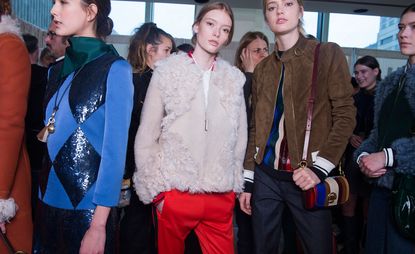 Females models wearing red, blue, brown and cream clothes from the Tory Burch A/W 2016 collection