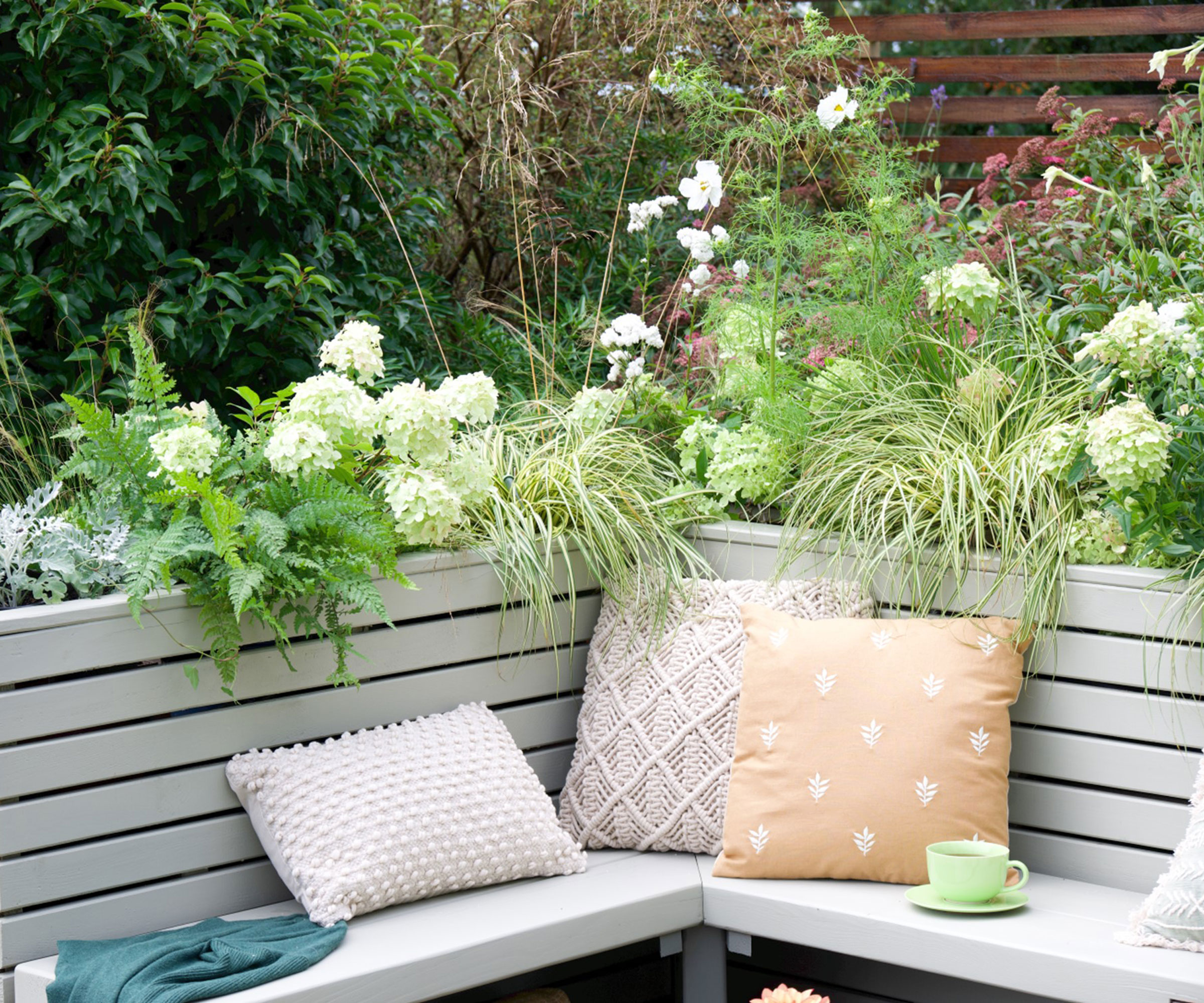 corner seat and raised bed planting