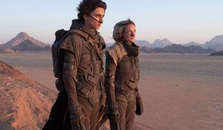 Timothée Chalamet and Rebecca Ferguson look out at the desert in Dune.