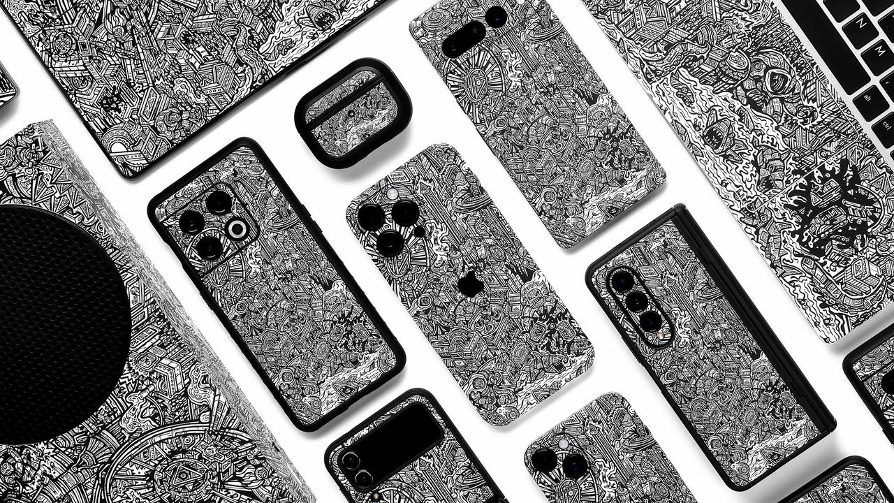 Dbrand Robot City skins on various devices.