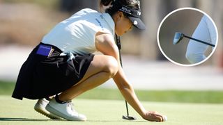 Lydia Ko lines up a putt on the green