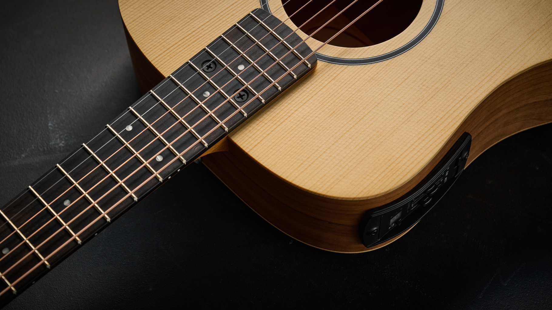 Close up of the neck and body on the Taylor BT1e Baby Taylor 3/4 acoustic guitar