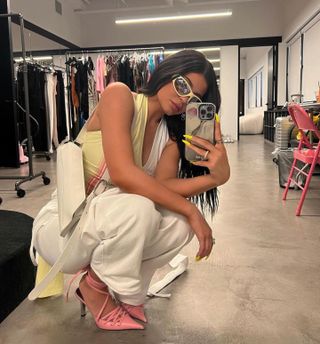 Kylie Jenner wearing yellow Poppy Lissiman sunglasses