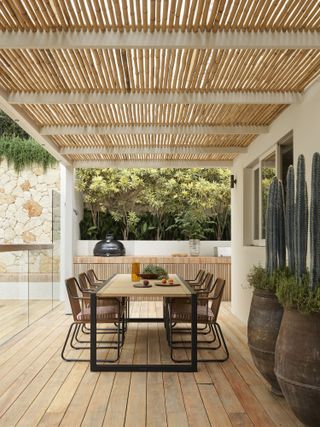 bamboo pergola canopy over patio by Wyer & Co