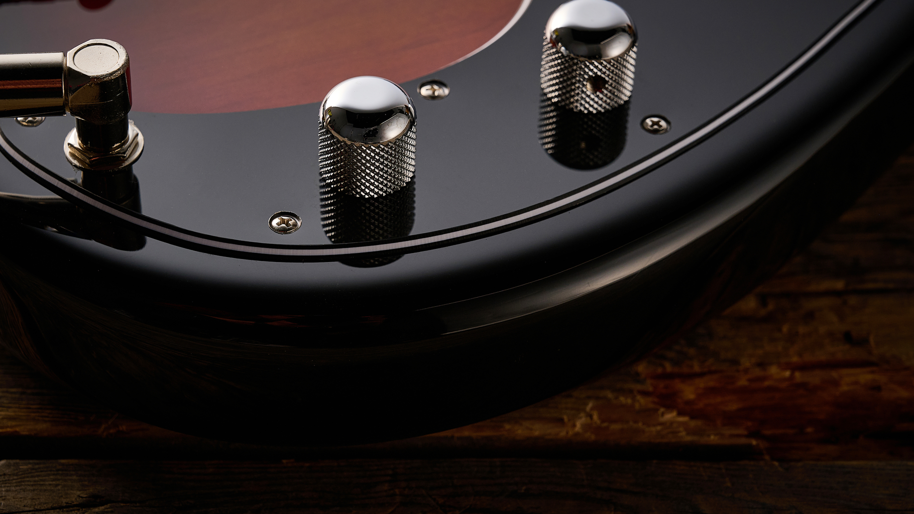 Fender American Professional Classic Precision Bass in 3-Color Sunburst shot on wood floor boards