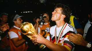 Lothar Matthaus celebrates with the World Cup trophy after West Germany's win in 1990.