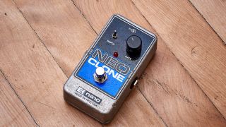 An Electro-Harmonix Neo Clone chorus pedal on a wooden floor