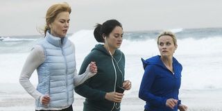 the trio of moms running on the beach
