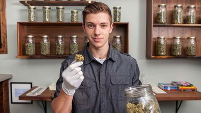 picture of man working at marijuana store