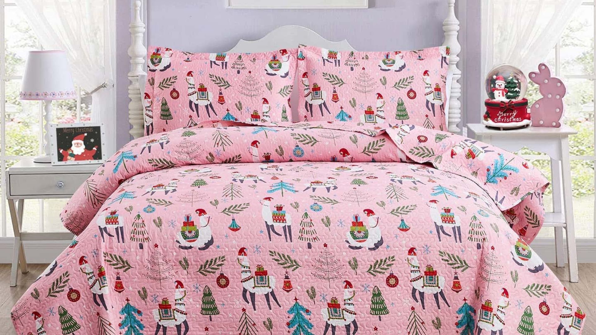 A light pink Christmas bedding cartoon quilt set made on a bed in a girly purple room.