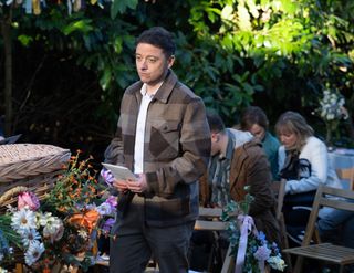 Matty standing by Amy's coffin in Emmerdale