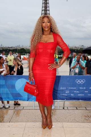 Serena Williams wears a red midi dress