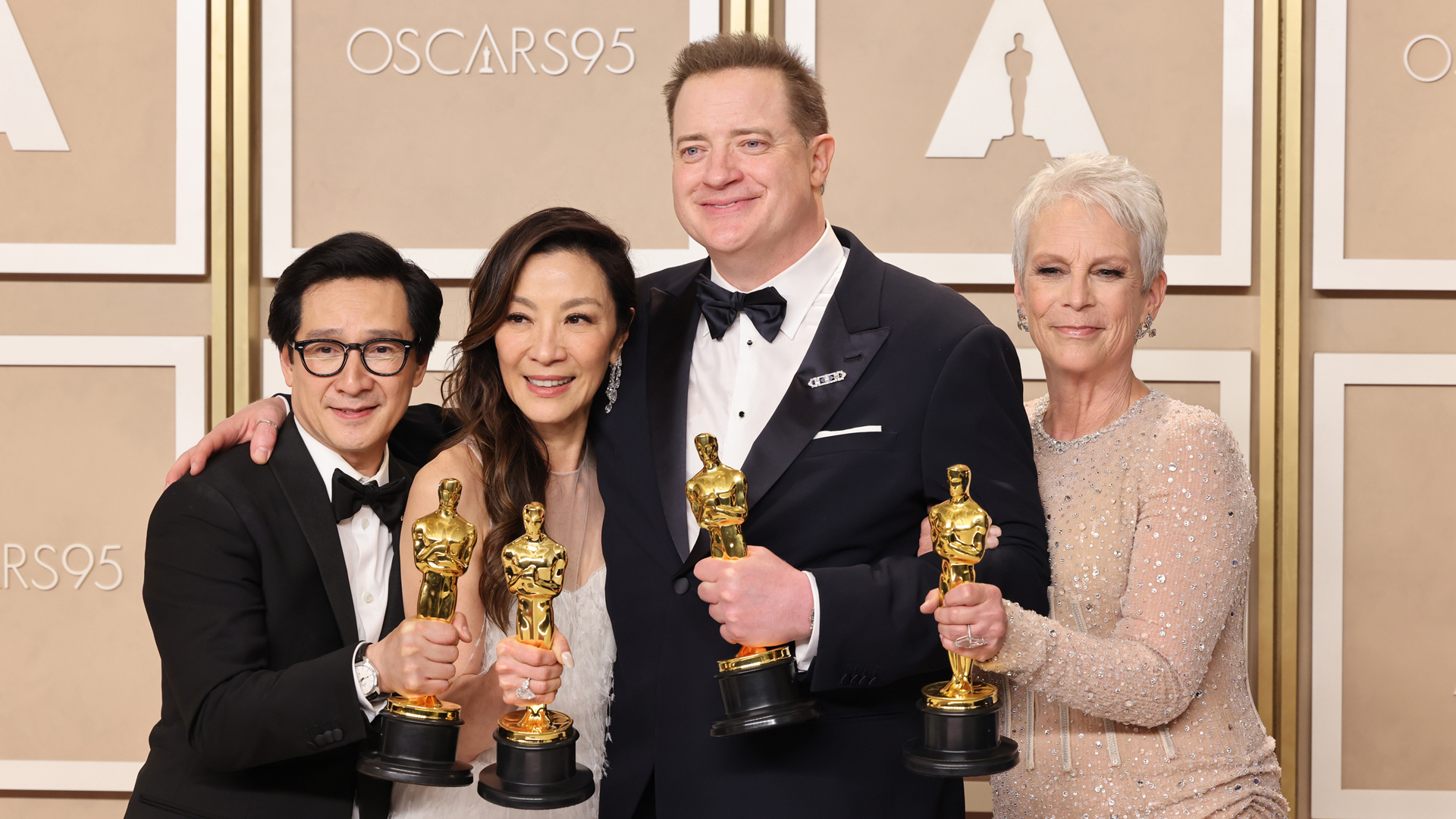 Brendan Fraser, Ke Huy Quan, Michelle Yeoh, and Jamie Lee Curtis pose with their Oscar trophies