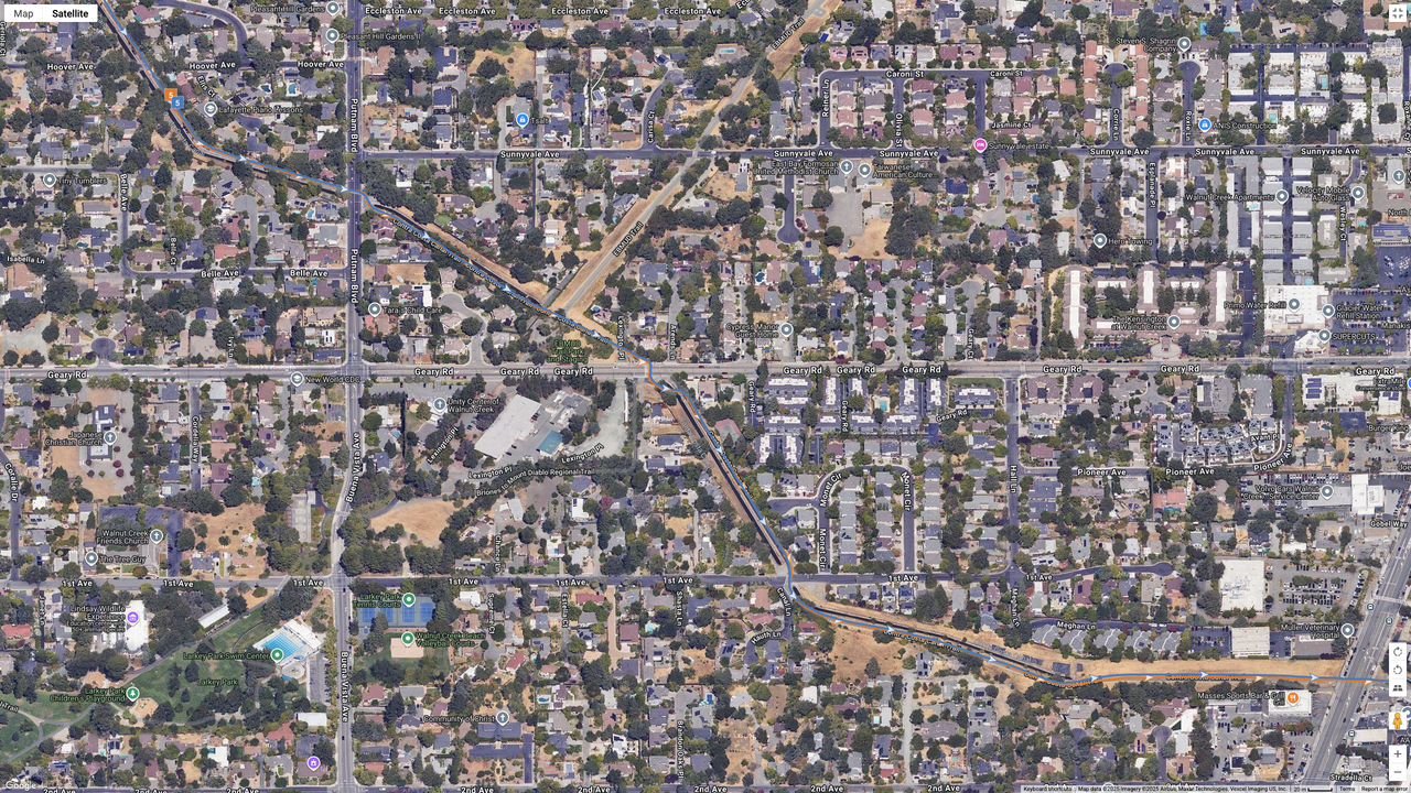 A Google Maps satellite image showing how the COROS PACE 4 (blue line) compares to the Garmin Forerunner 970 (orange line) for dual-frequency GPS accuracy for a suburban route.