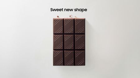 Samsung social media teaser of a chocolate bar with text reading "sweet new shape"