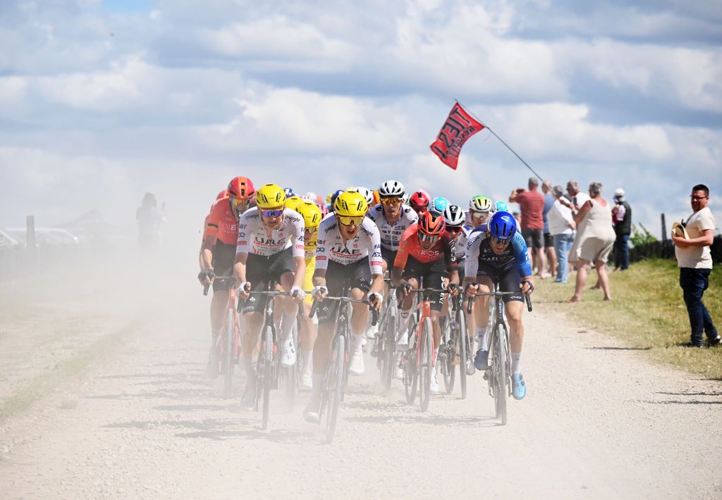TROYES FRANCE JULY 07 LR Tim Wellens of Belgium Tadej Pogacar of Slovenia Yellow Leader Jersey Marc Soler of Spain and UAE Team Emirates Egan Bernal of Colombia and Team INEOS Grenadiers and Hugo Houle of Canada and Team Israel Premier Tech compete passing through a gravel strokes sector during the 111th Tour de France 2024 Stage 9 a 199km stage from Troyes to Troyes UCIWT on July 07 2024 in Troyes France Photo by Bernard Papon PoolGetty Images