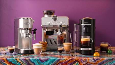 Three De'Longhi coffee makers on multi-colored kitchen counter with various coffee drinks
