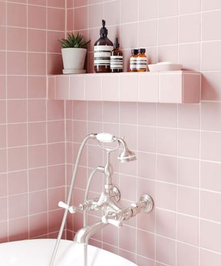 Pink bathroom and white bathtub