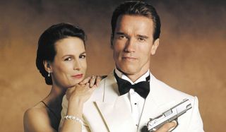 True Lies Jamie Lee Curtis and Arnold Schwarzenegger posing in formal wear