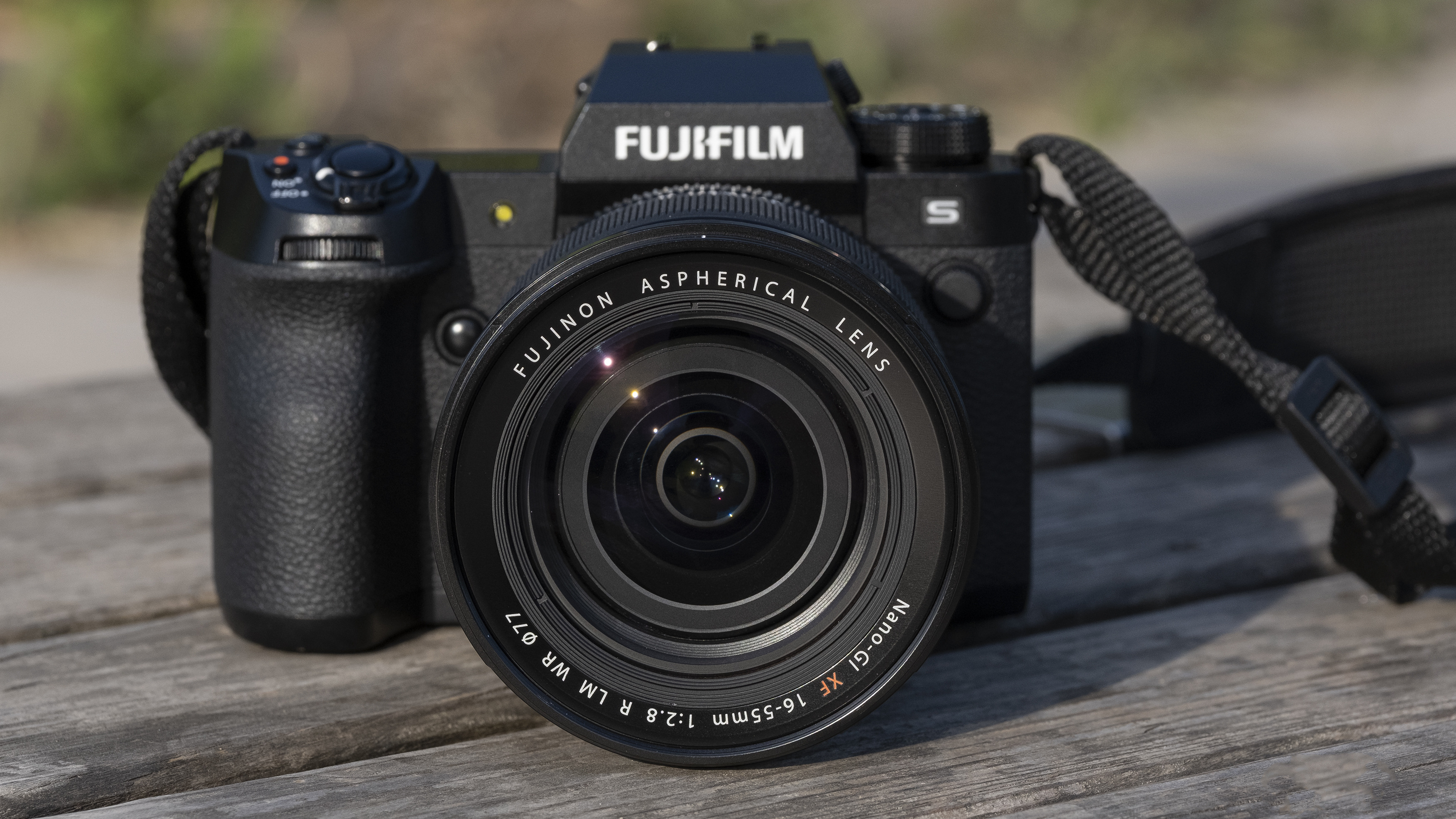 The Fujifilm X-H2S camera sitting on a wooden bench