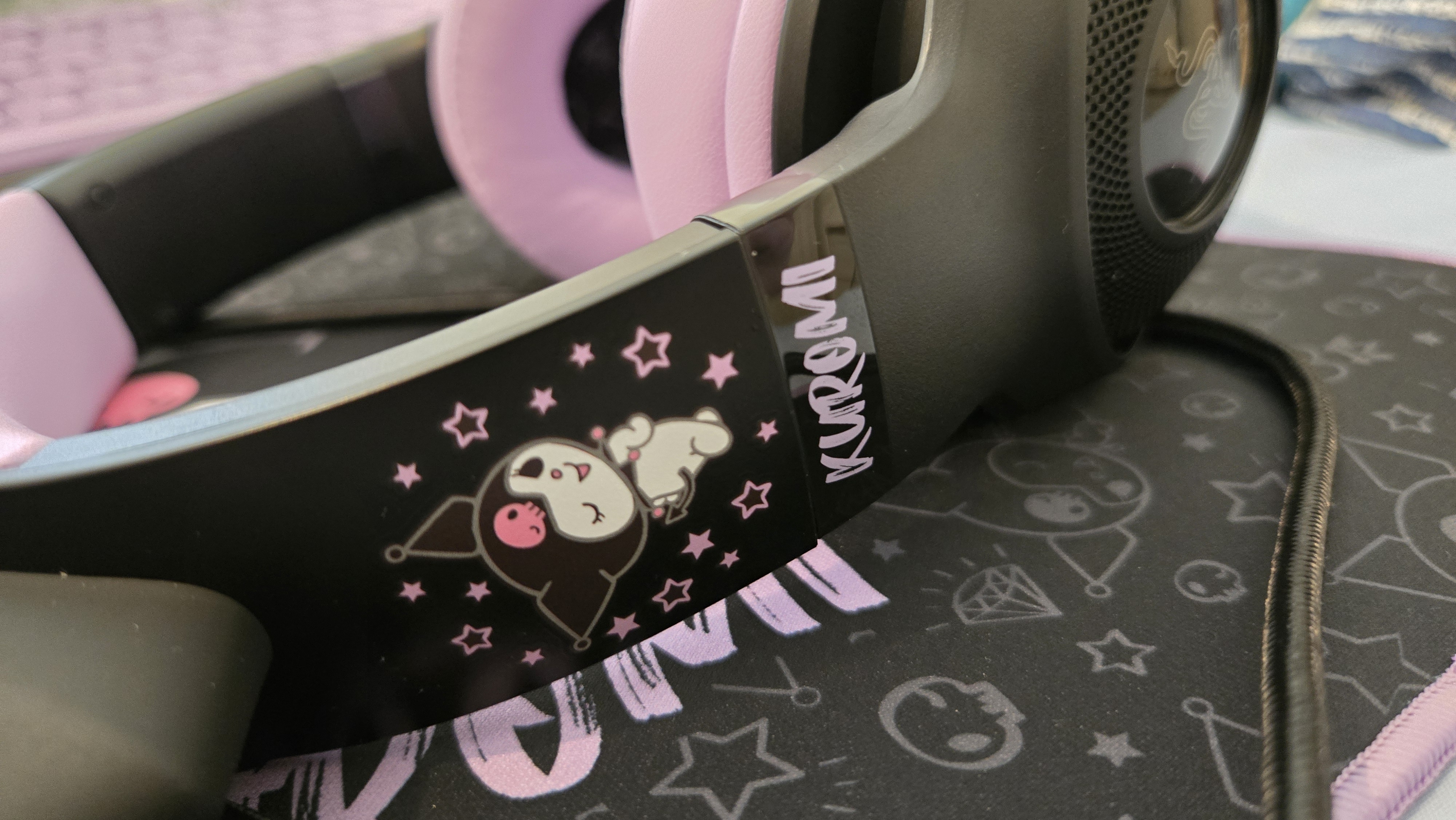 Razer | Kuromi collection peripherals laid out on a desk.