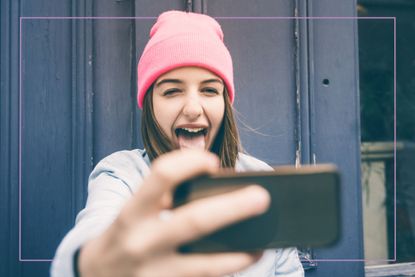 Teenager pulling tongue out at camera