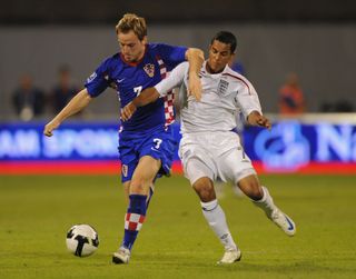 Theo Walcott of England fights for the ball with Ivan Rakitic of Croatia during the FIFA 2010 World Cup Qualifying Group Six match between Croatia and England at the Maksimir Stadium on September 10, 2008 in Zagreb, Croatia. (Photo by Shaun Botterill/Getty Images)