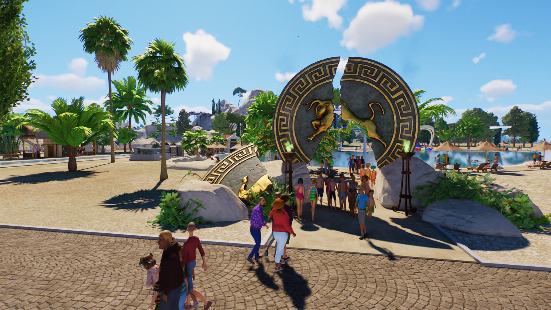 Theme park guests walking along a path in front of a gate made out of broken Grecian seal.