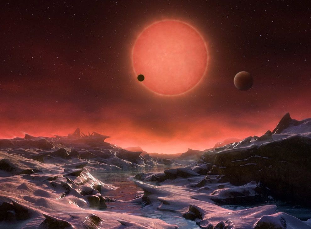 This artist&#039;s illustration depicts an imagined view from the surface of one of the three newfound TRAPPIST-1 alien planets. The planets have sizes and temperatures similar to those of Venus and Earth, making them the best targets yet for life beyond our s