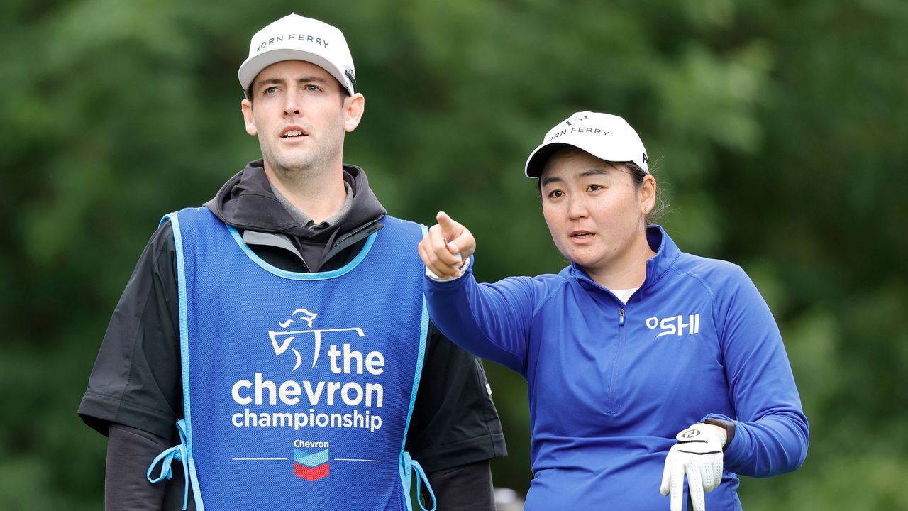 Allisen Corpuz and her caddie Jay Monahan discuss a shot