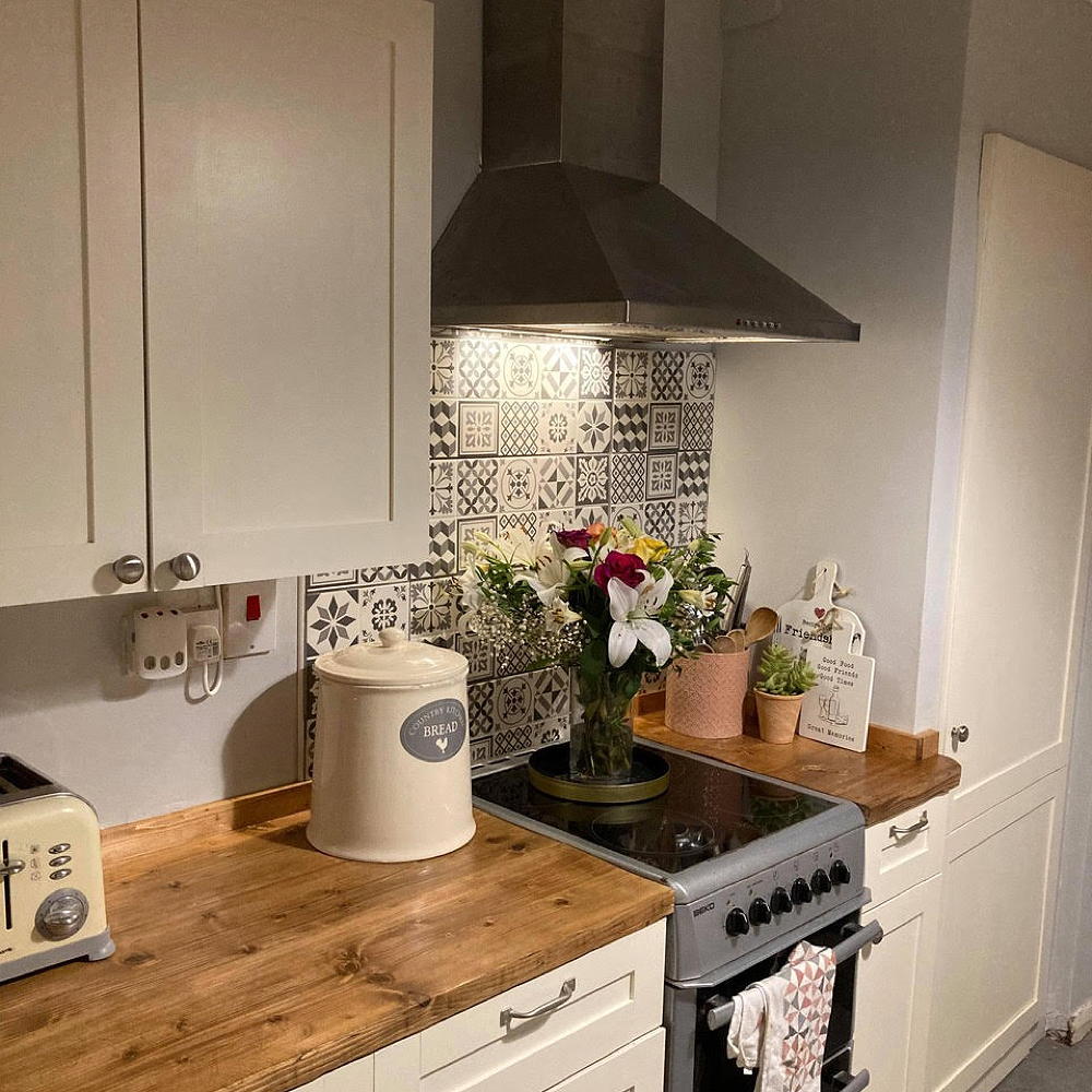 kitchen with chimney white cabinet and wooden worktop