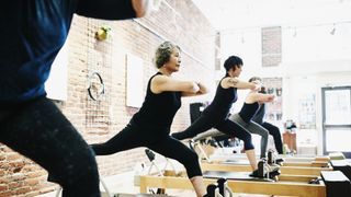 People doing reformer pilates