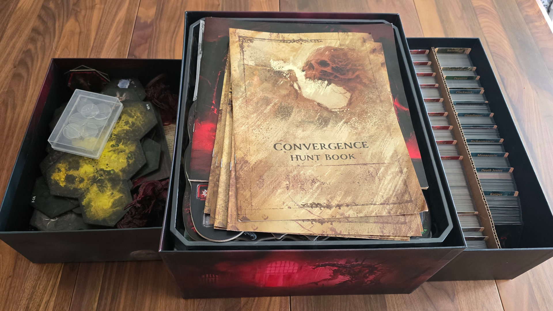 Grimcoven box and components, laid out on a wooden table