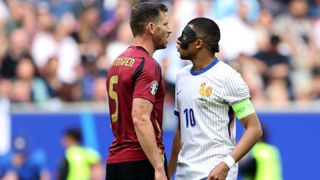 Jan Vertonghen of Belgium clashes with Kylian Mbappe of France, whilst wearing a Black Protective Face Mask, during the UEFA EURO 2024 round of 16 match between France and Belgium at Düsseldorf Arena on July 01, 2024 in Dusseldorf, Germany. (Photo by Matt McNulty - UEFA/UEFA via Getty Images)