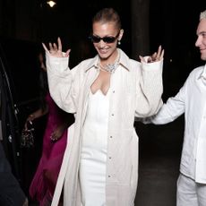 Bella Hadid wears a corset lace up heel.