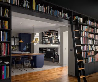 inside of extension showing bespoke library areas and kitchen