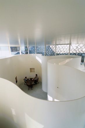 Interior view of 'Clover House' which has white, curved walls