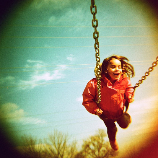 Lomography: girl on swing